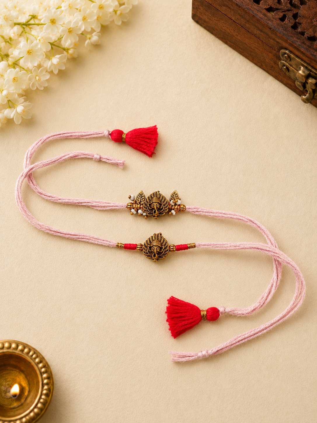 Pink Ganesha Rakhi Set with Red Tassel