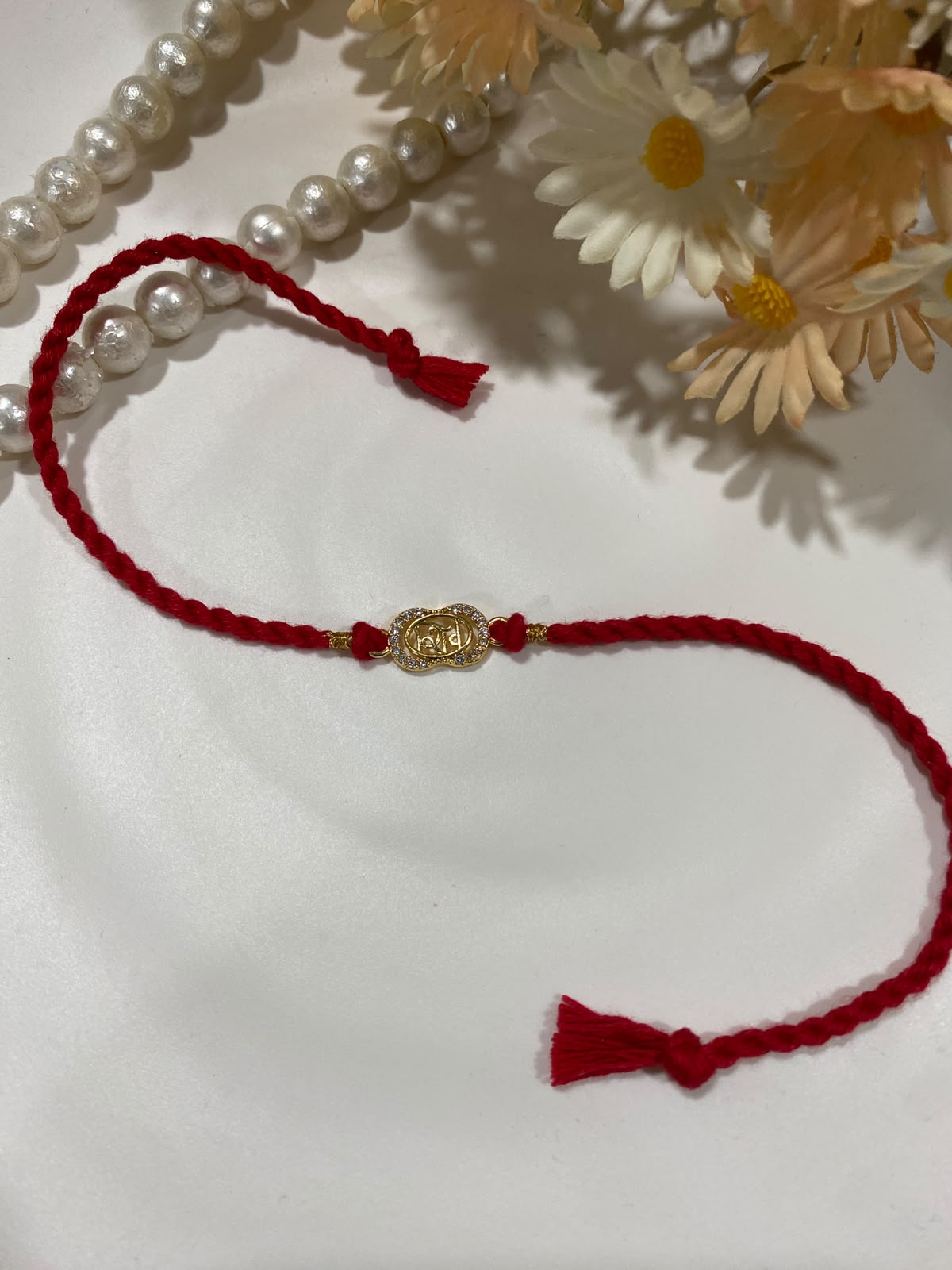 Om Zircon Rakhi – Minimal Red Thread Rakhi for Bhai | Shrung