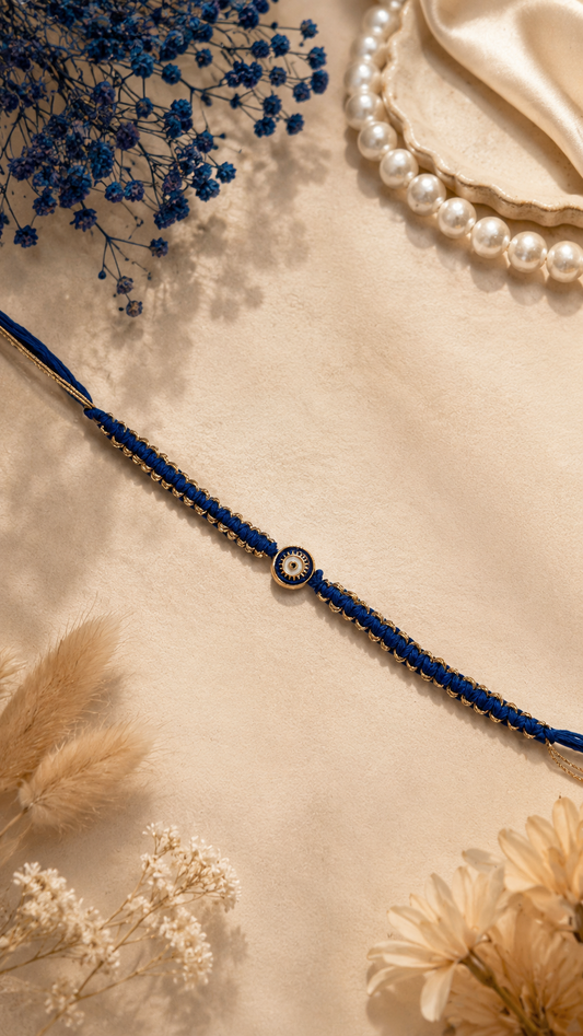 Navy Blue Macrame Thread Rakhi with Gold Sun Eye Pendant for Brother