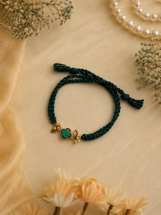 Teal Thread Rakhi with Green Clover Charm for Bhabhi