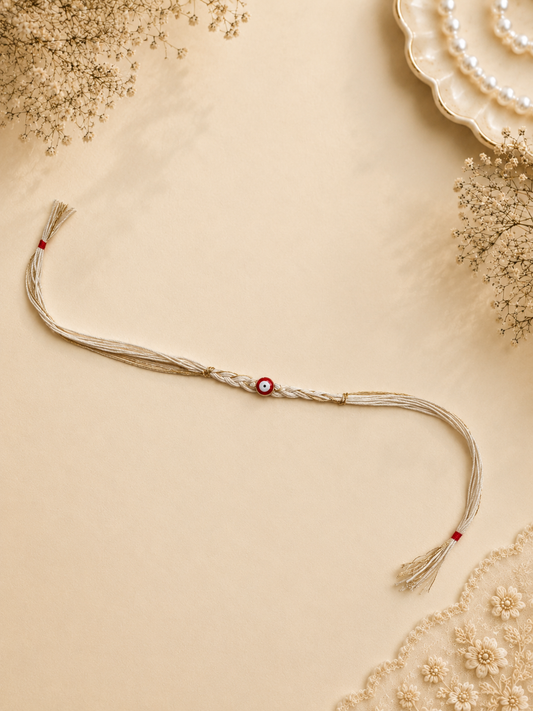 Cream Gold Braided Thread Evil Eye Rakhi with Red Nazar Bead for Brother