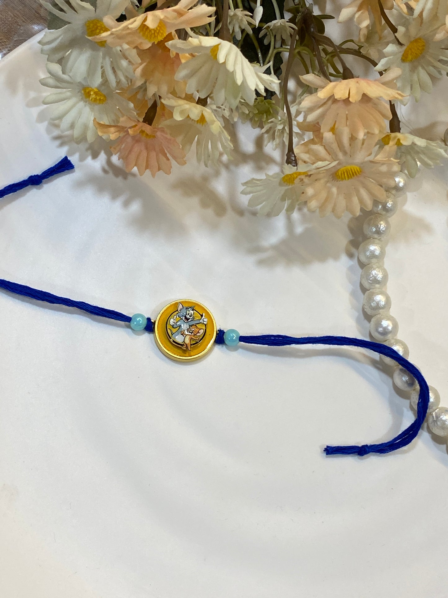 Tom n jerry Spinner Rakhi for Kids – Rakhi with Rotating Charm