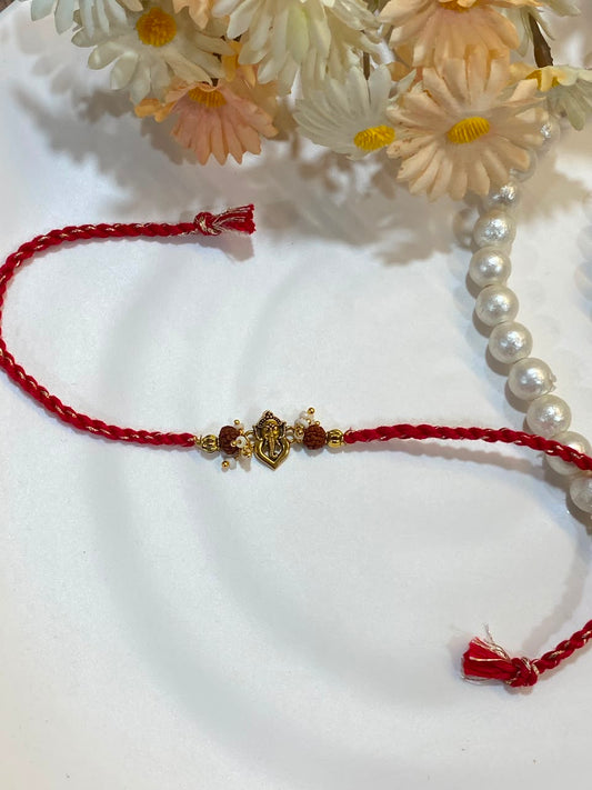Ganesha Rudraksha Pearl Rakhi – Embellished Red Thread Rakhi for Brother