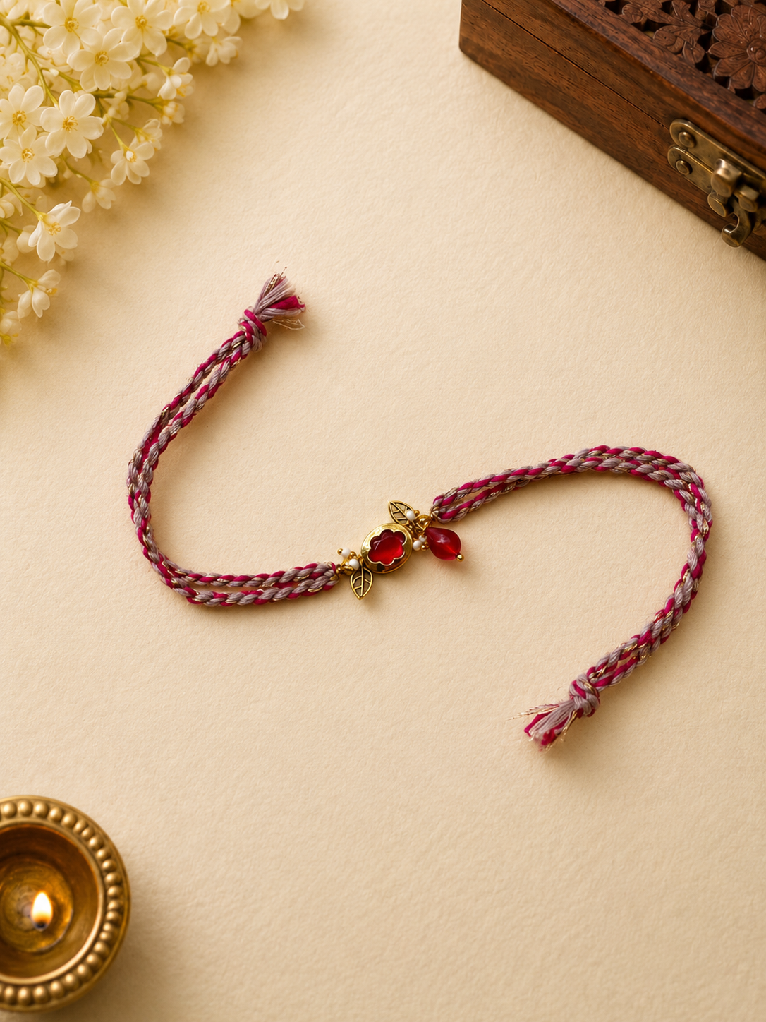 Pink Grey Thread Rakhi with Floral Charm for Bhabhi