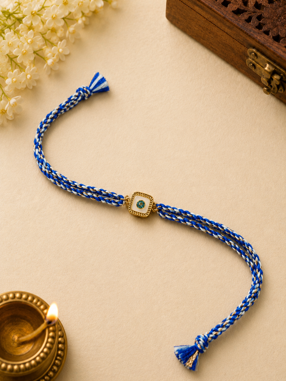 Blue Twisted Thread Rakhi with Gold Evil Eye Charm for Brother