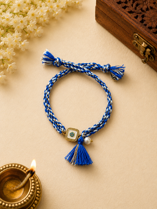 Blue White Thread Rakhi with Floral Charm & Tassel for Bhabhi